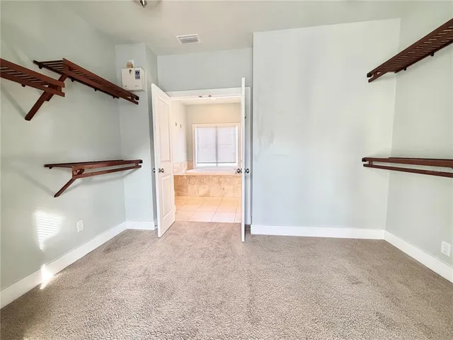 a view of a room with rack on the wall