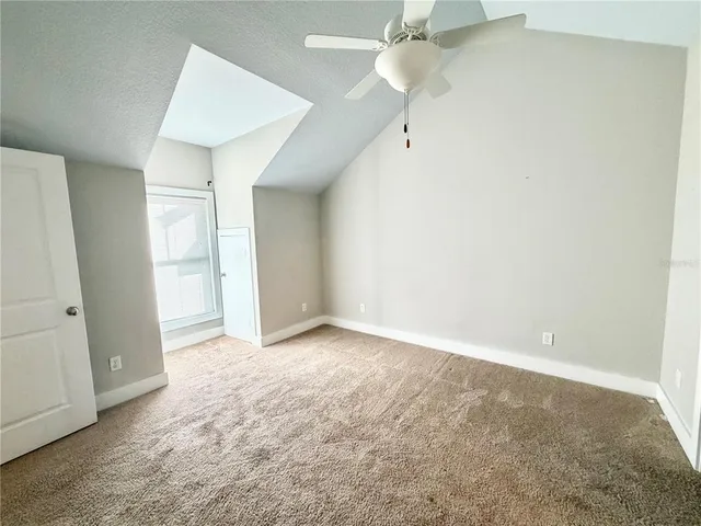 a view of front door with a utility and a sink