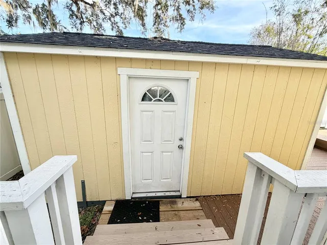 a bathroom with a sink shower and a mirror