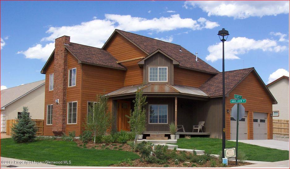 728 East 18th Street Rifle, CO 81650 - Photo 1 of 1 a front view of a house with garden