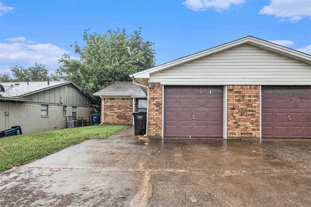 6817 West Cleburne Road Fort Worth, TX 76133 - Photo 2 of 24 front view of a house with a yard