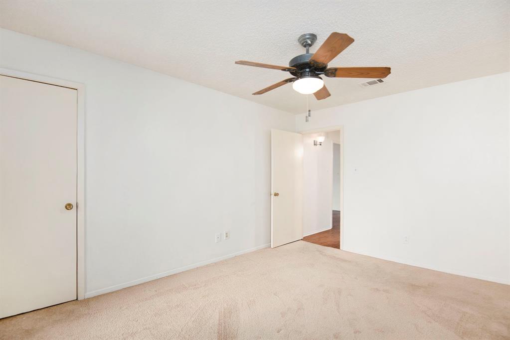 6817 West Cleburne Road Fort Worth, TX 76133 - Photo 21 of 24 a view of room with a ceiling fan