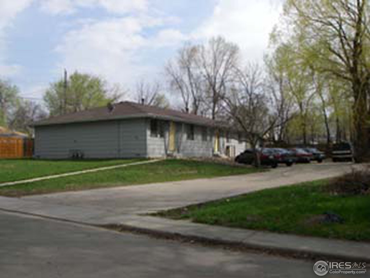 131 Reed Place, Unit 3 Longmont, CO 80504 - Photo 2 of 3 a view of street with house in background