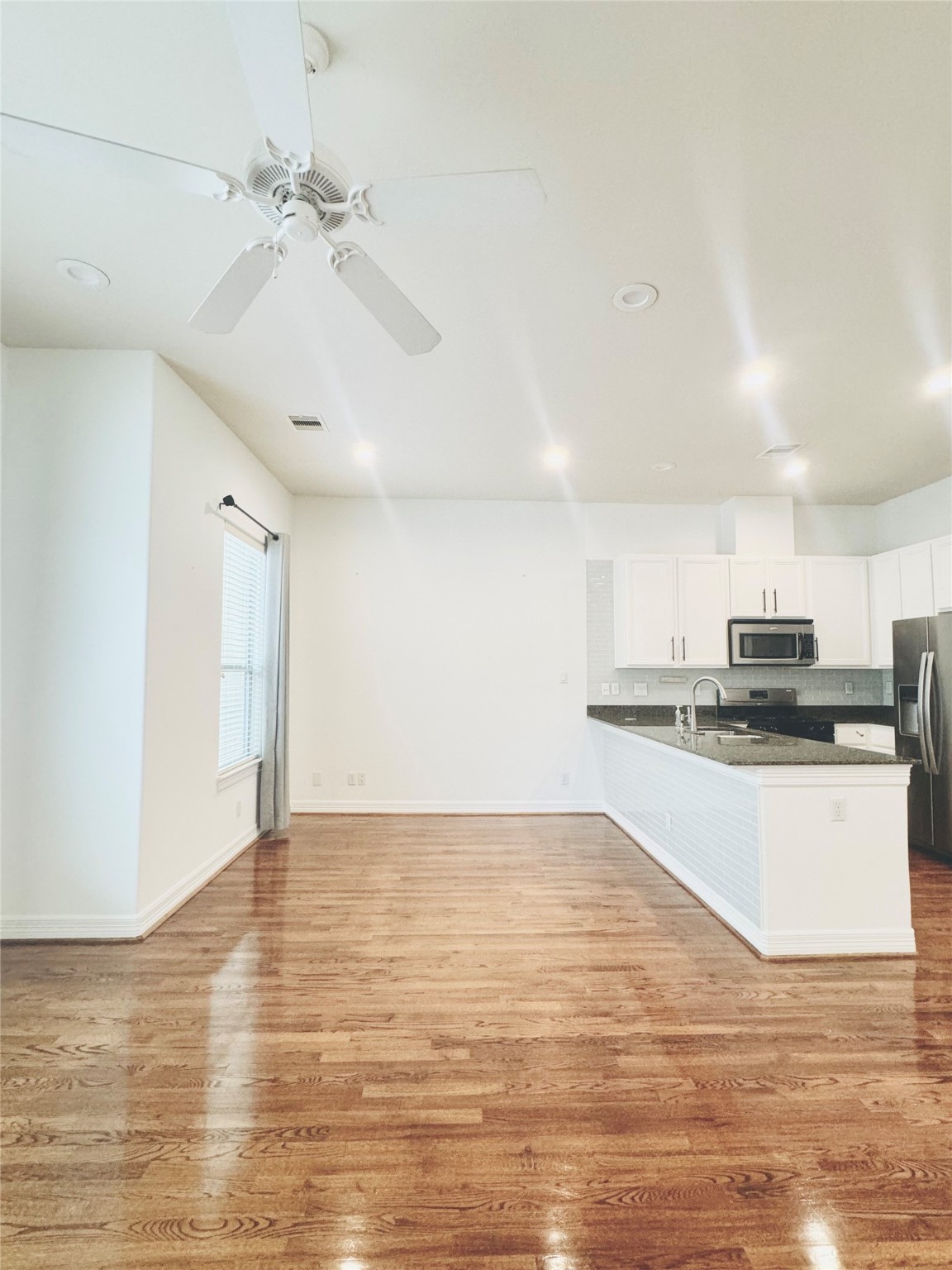 3846 Center Street Houston, TX 77007 - Photo 18 of 37 a view of a kitchen with stainless steel appliances a sink and a refrigerator