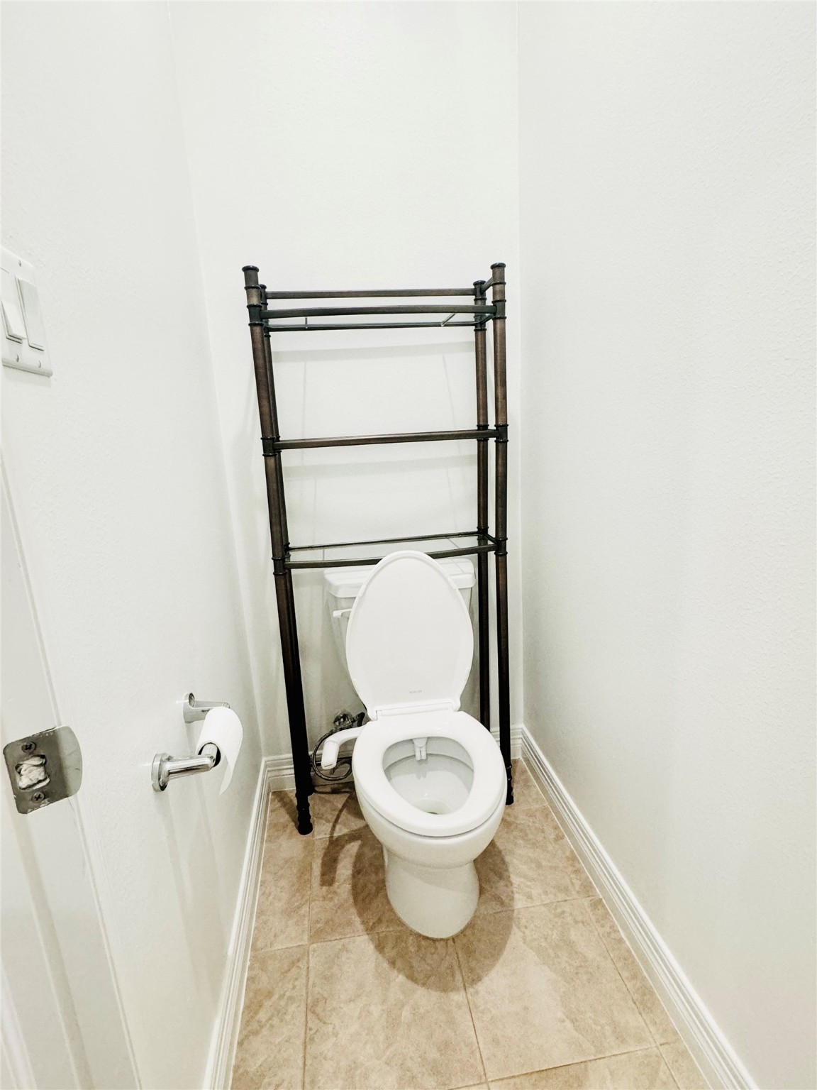 3846 Center Street Houston, TX 77007 - Photo 27 of 37 a white toilet sitting next to a shower