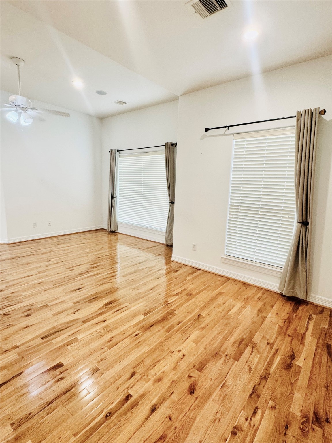 3846 Center Street Houston, TX 77007 - Photo 30 of 37 a view of an empty room with wooden floor and a window
