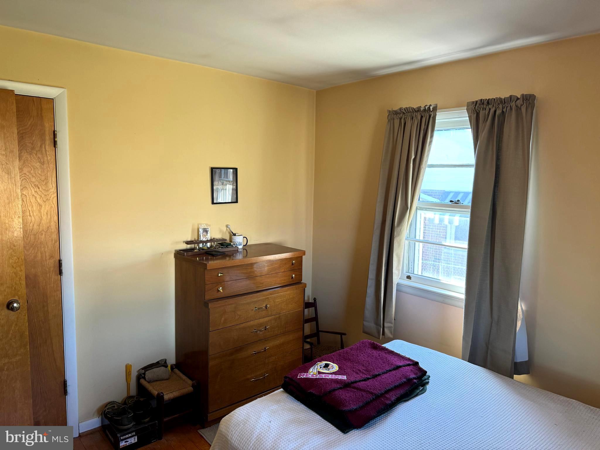 1309 Commerce Street Winchester, VA 22601 - Photo 13 of 27 a bedroom with a bed and a window