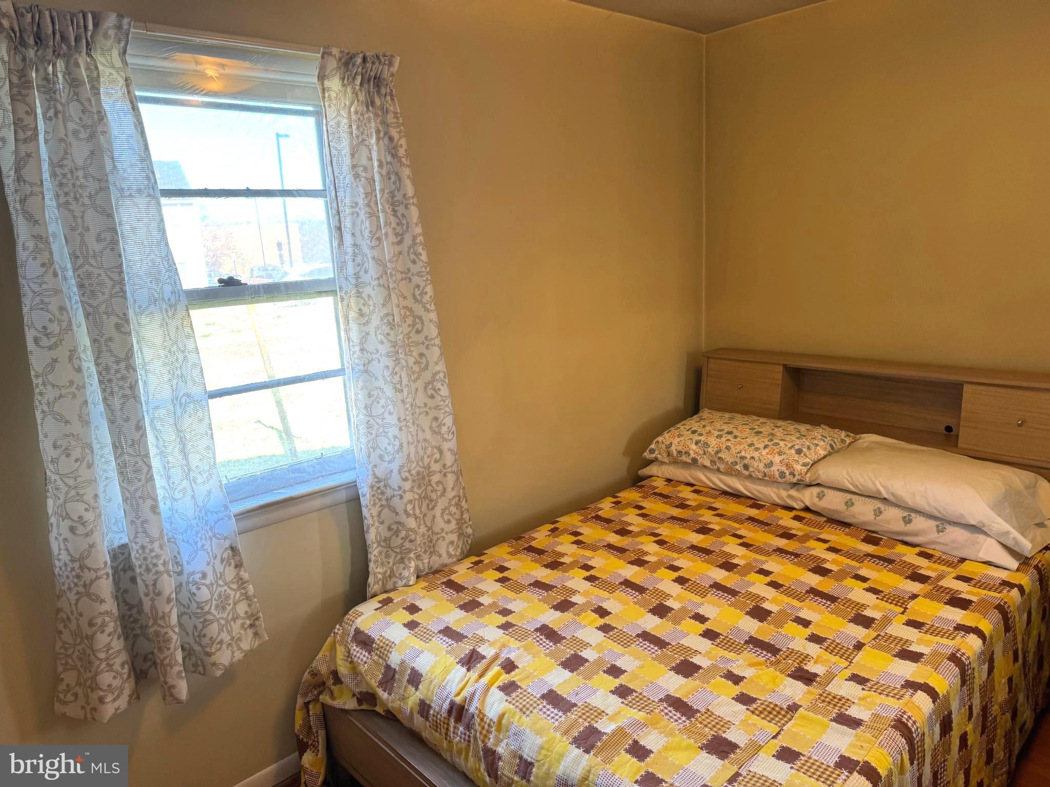 1309 Commerce Street Winchester, VA 22601 - Photo 14 of 27 a bedroom with a bed and a window
