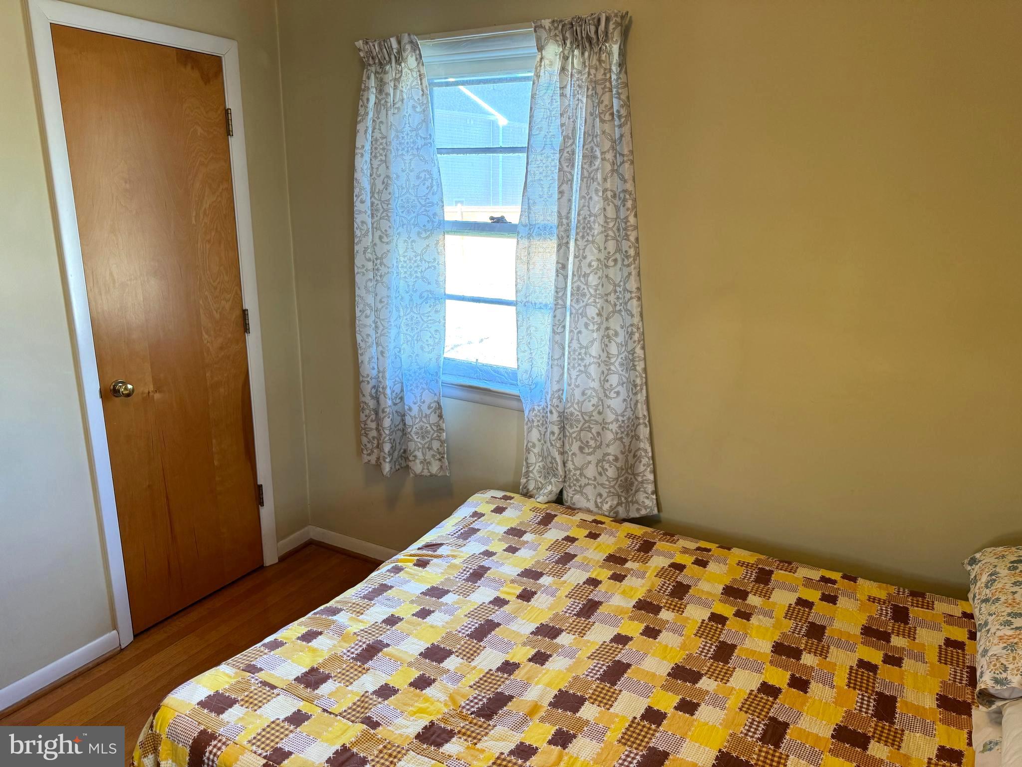 1309 Commerce Street Winchester, VA 22601 - Photo 15 of 27 a bedroom with a bed and a window