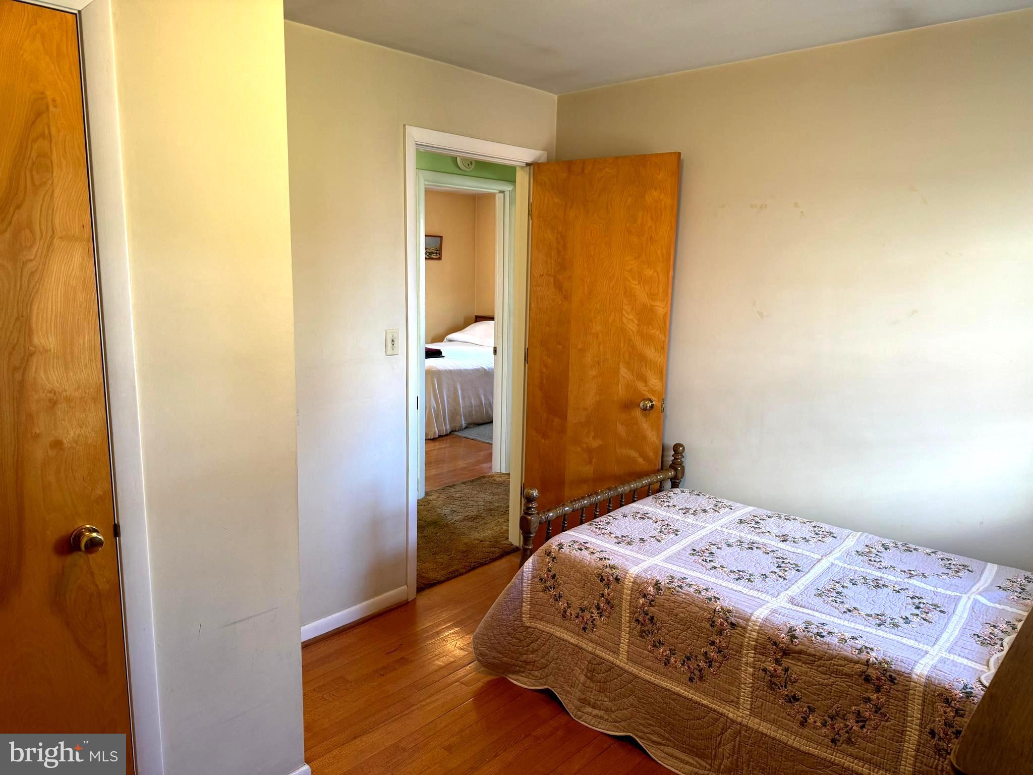 1309 Commerce Street Winchester, VA 22601 - Photo 17 of 27 a bedroom with a bed and wooden floor