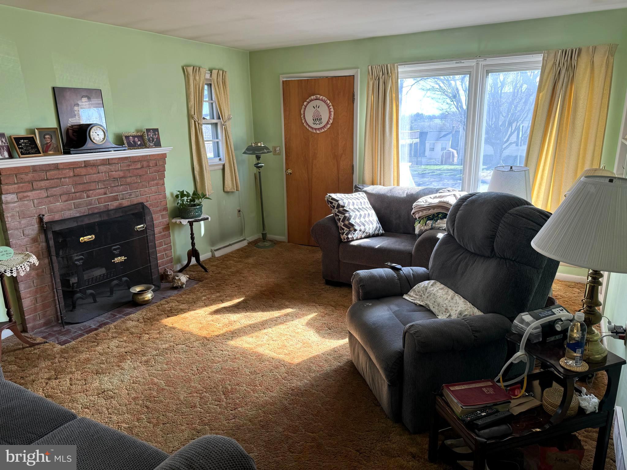 1309 Commerce Street Winchester, VA 22601 - Photo 4 of 27 a living room with furniture and a fireplace