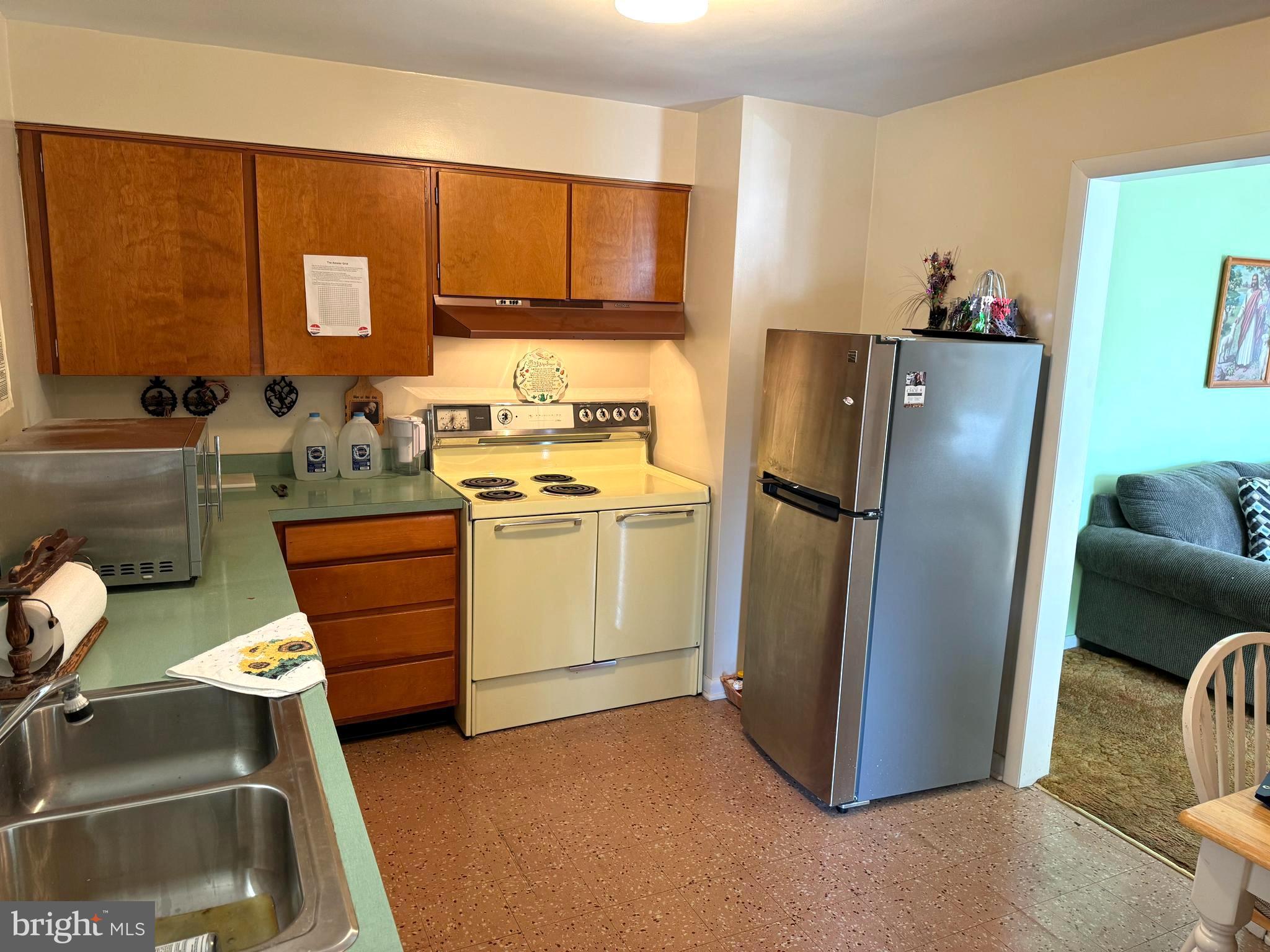 1309 Commerce Street Winchester, VA 22601 - Photo 6 of 27 a kitchen with stainless steel appliances a refrigerator and a sink