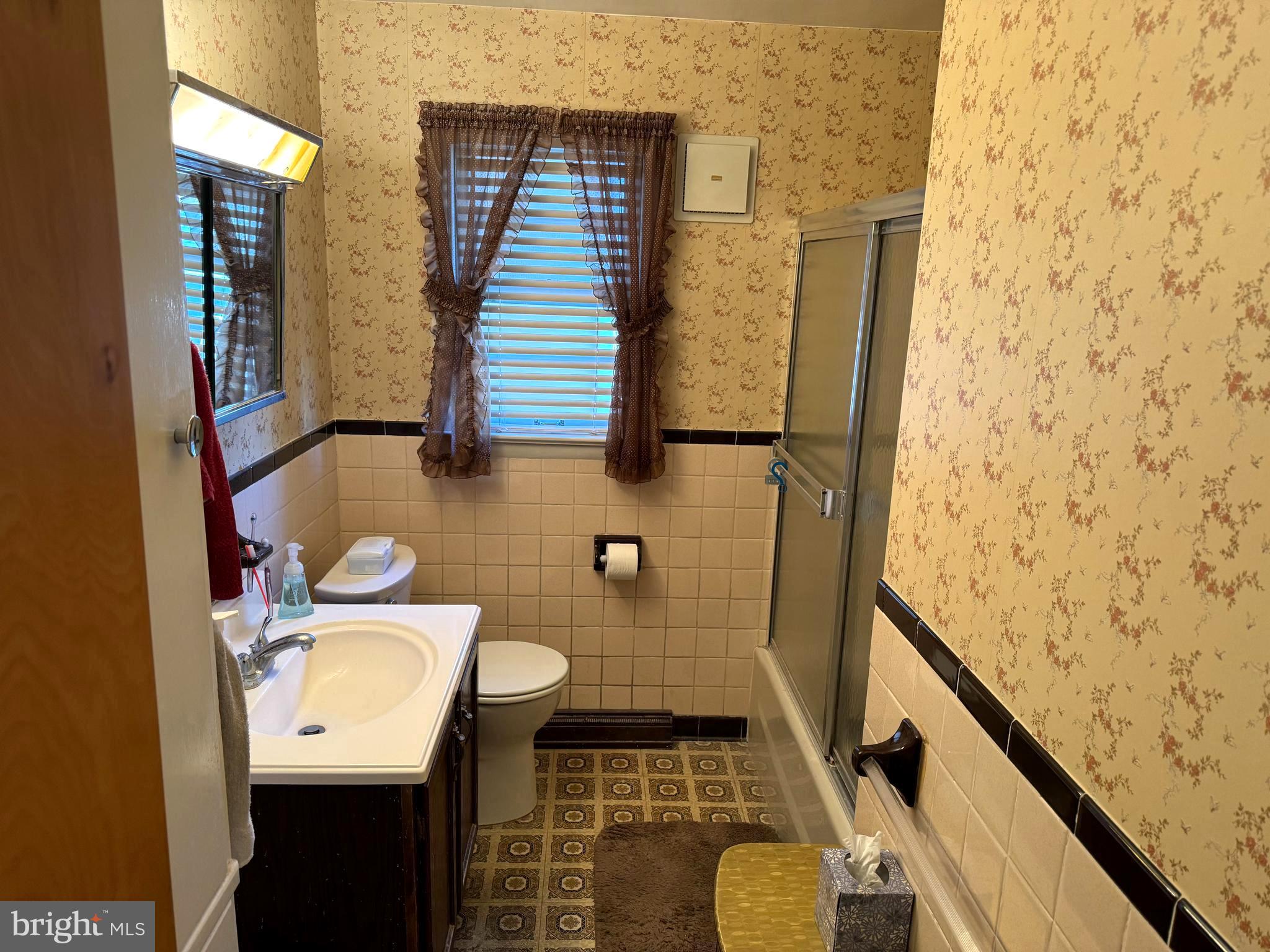 1309 Commerce Street Winchester, VA 22601 - Photo 10 of 27 a bathroom with a sink toilet and shower