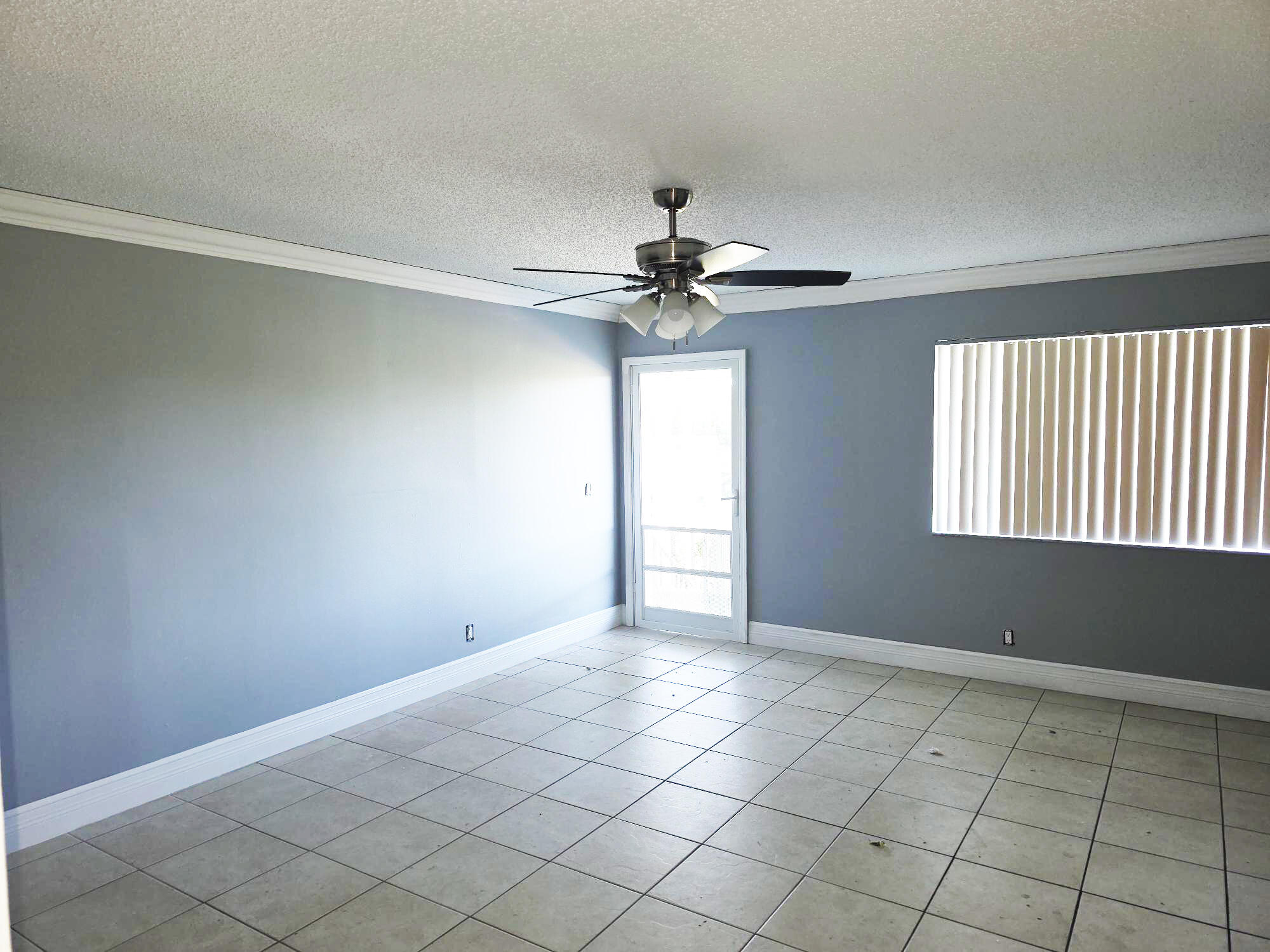 3300 Springdale Boulevard, Unit 318 Palm Springs, FL 33461 - Photo 11 of 34 a view of an empty room with a window