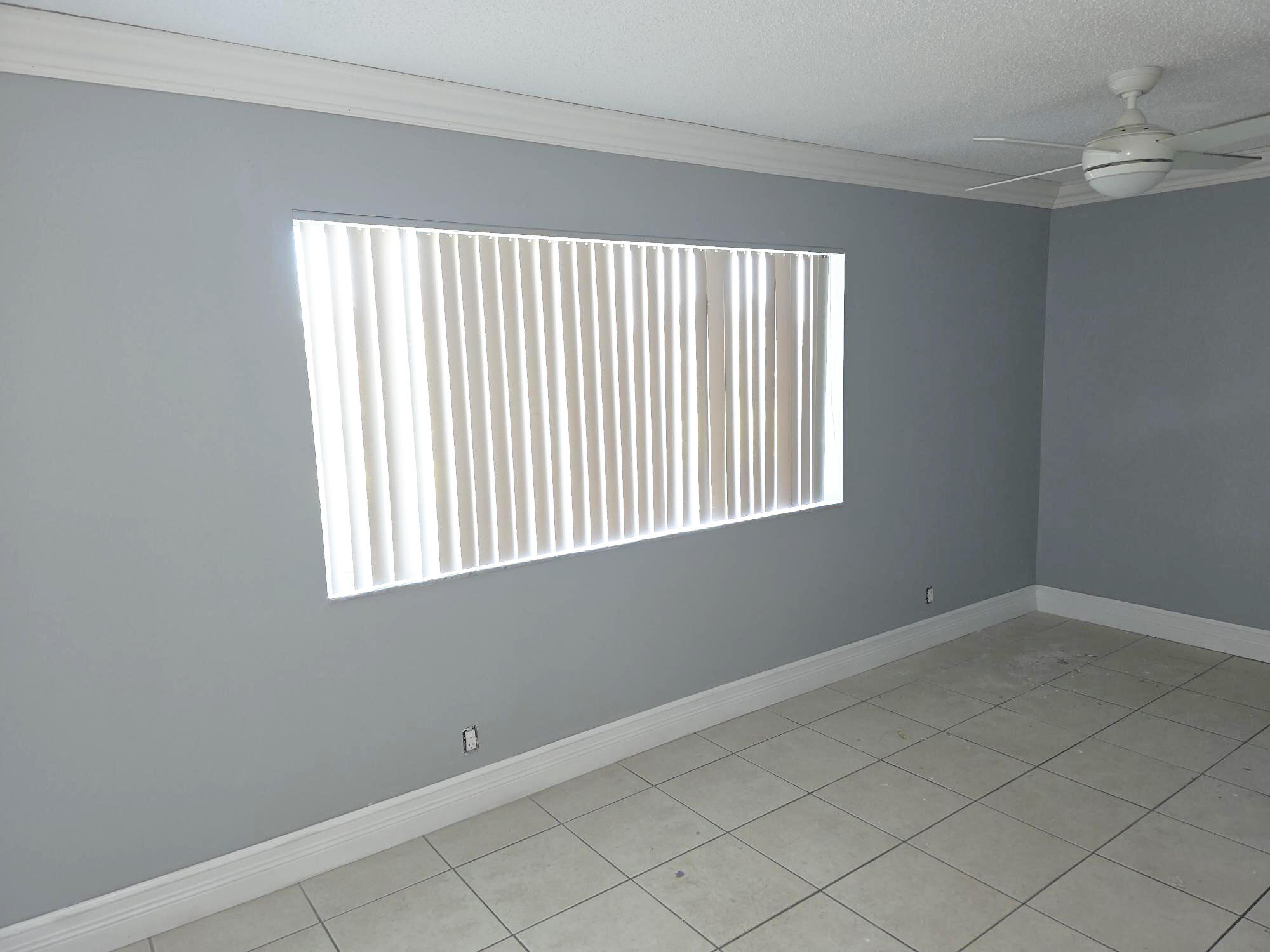 3300 Springdale Boulevard, Unit 318 Palm Springs, FL 33461 - Photo 12 of 34 an empty room with a window