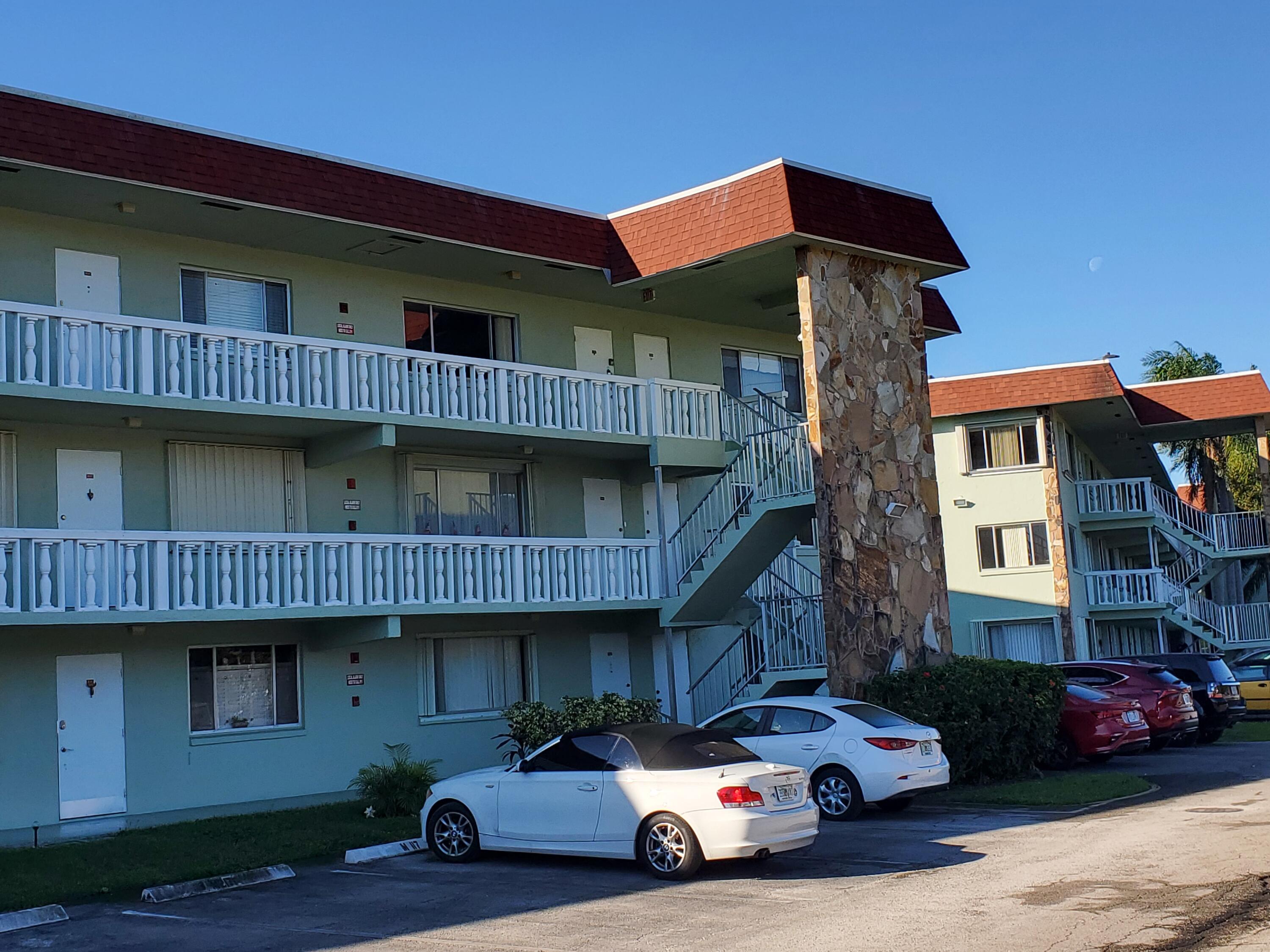 3300 Springdale Boulevard, Unit 318 Palm Springs, FL 33461 - Photo 2 of 34 a car parked in front of a house