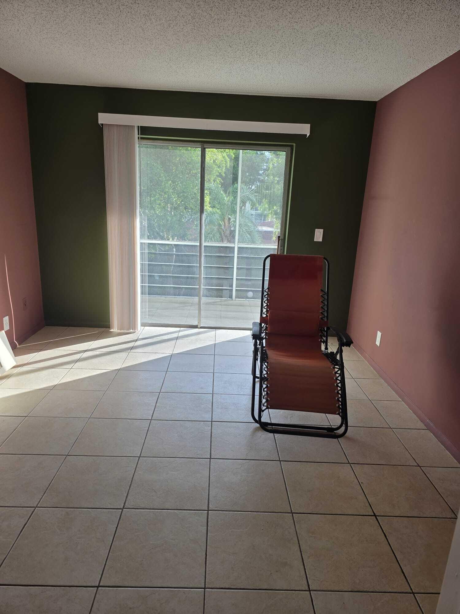 3300 Springdale Boulevard, Unit 318 Palm Springs, FL 33461 - Photo 29 of 34 a room with a window