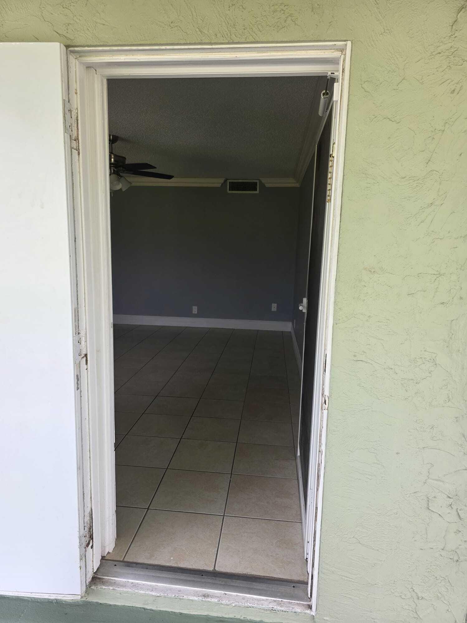 3300 Springdale Boulevard, Unit 318 Palm Springs, FL 33461 - Photo 33 of 34 a bathroom with a glass shower door