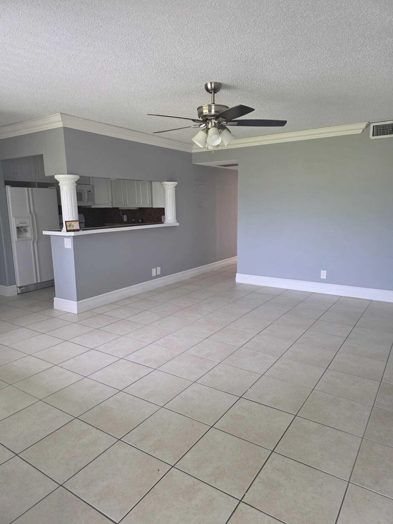 3300 Springdale Boulevard, Unit 318 Palm Springs, FL 33461 - Photo 8 of 34 a view of an empty room with a window