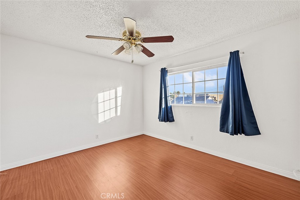 330 West Laurel Street, Unit C Compton, CA 90220 - Photo 15 of 16 a view of a room with wooden floor and staircase