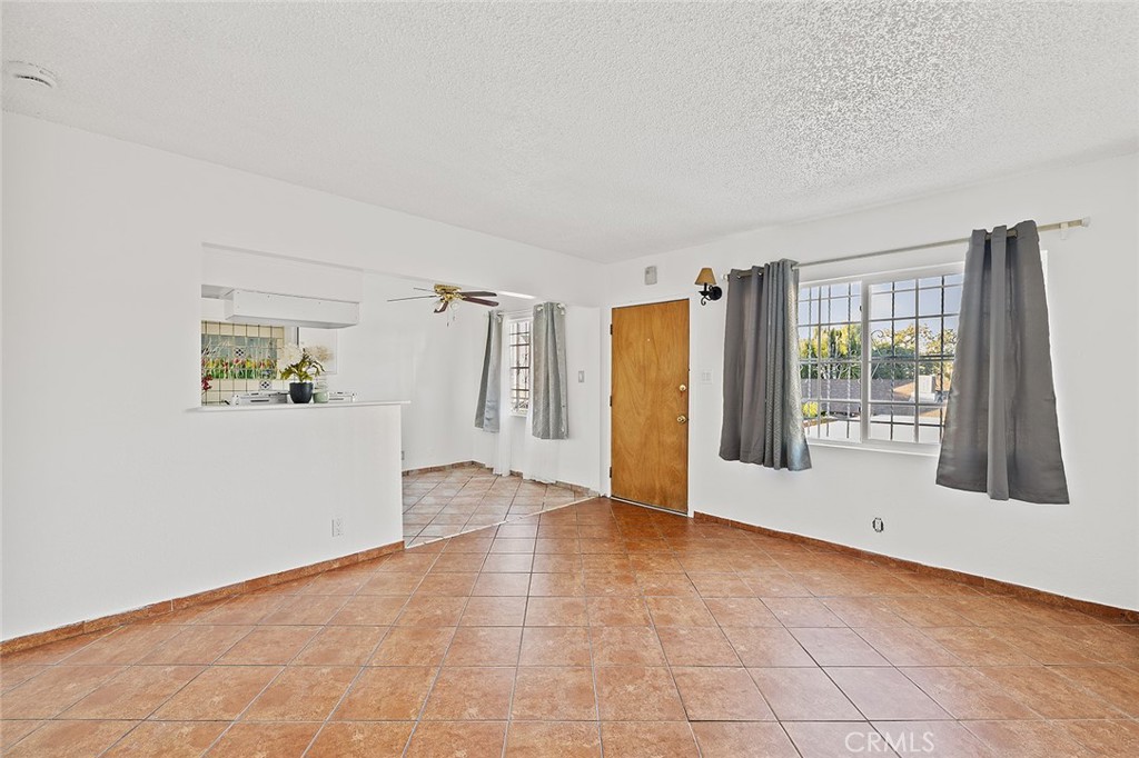 330 West Laurel Street, Unit C Compton, CA 90220 - Photo 7 of 16 a view of an empty room with a window
