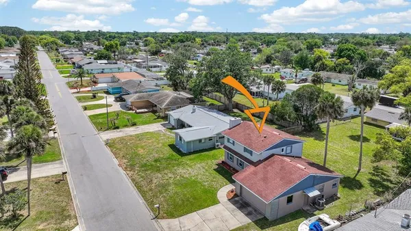 an aerial view of a house with a garden