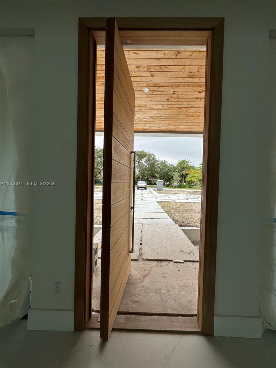 6190 Southwest 128th Street Pinecrest, FL 33156 - Photo 10 of 34 a view of a glass door and the window