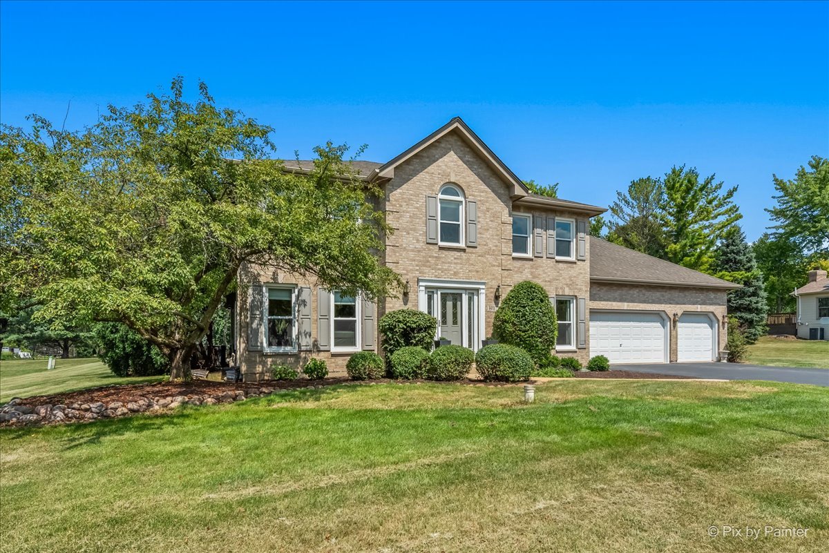 39W278 Baert Road St. Charles, IL 60175 - Photo 1 of 47 a front view of house with yard and green space
