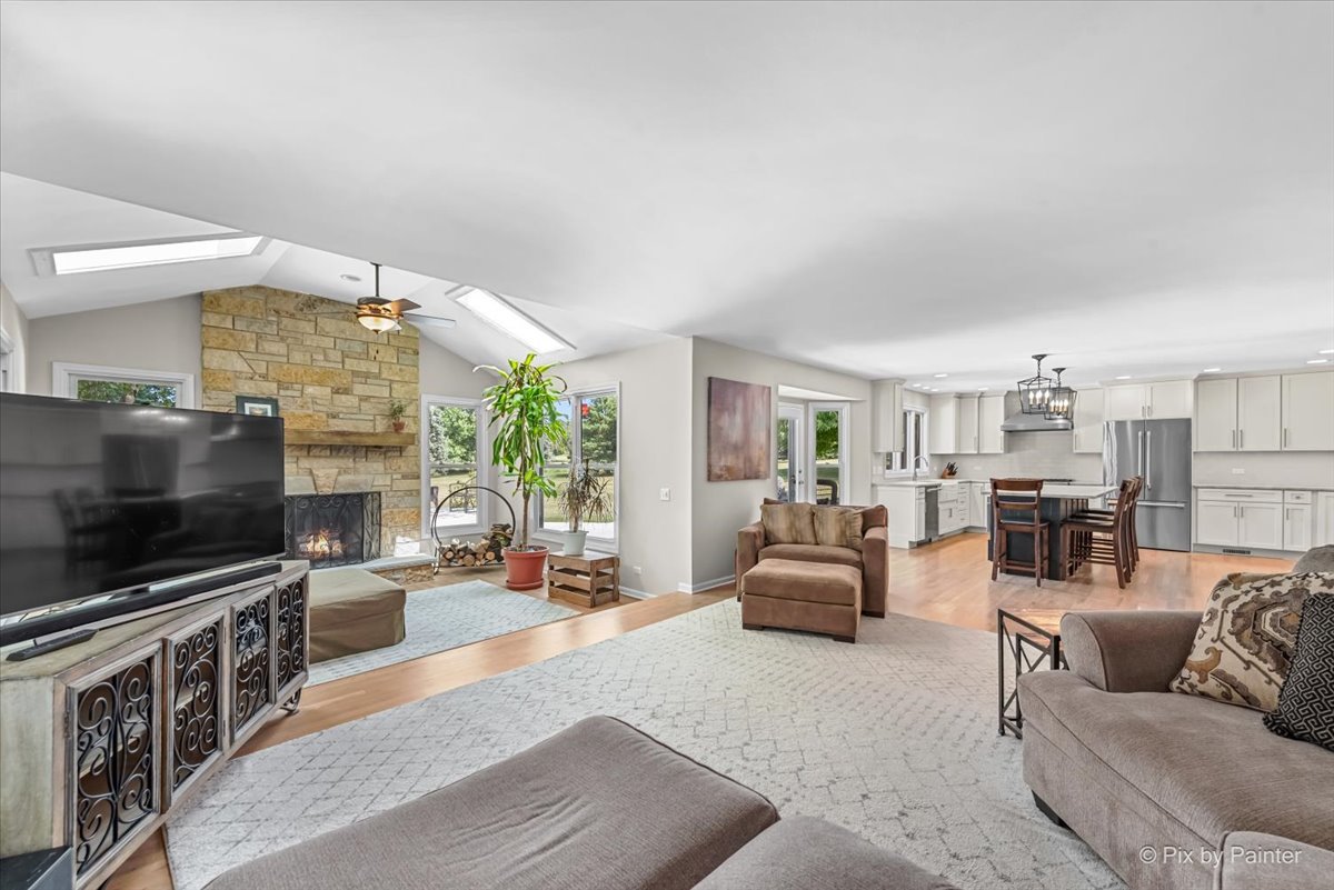 39W278 Baert Road St. Charles, IL 60175 - Photo 13 of 47 a living room with furniture and a flat screen tv
