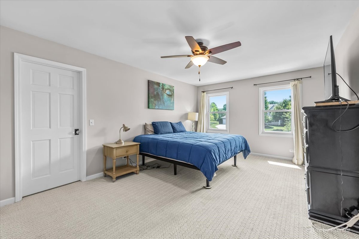 39W278 Baert Road St. Charles, IL 60175 - Photo 16 of 47 a spacious bedroom with a bed dresser and a window