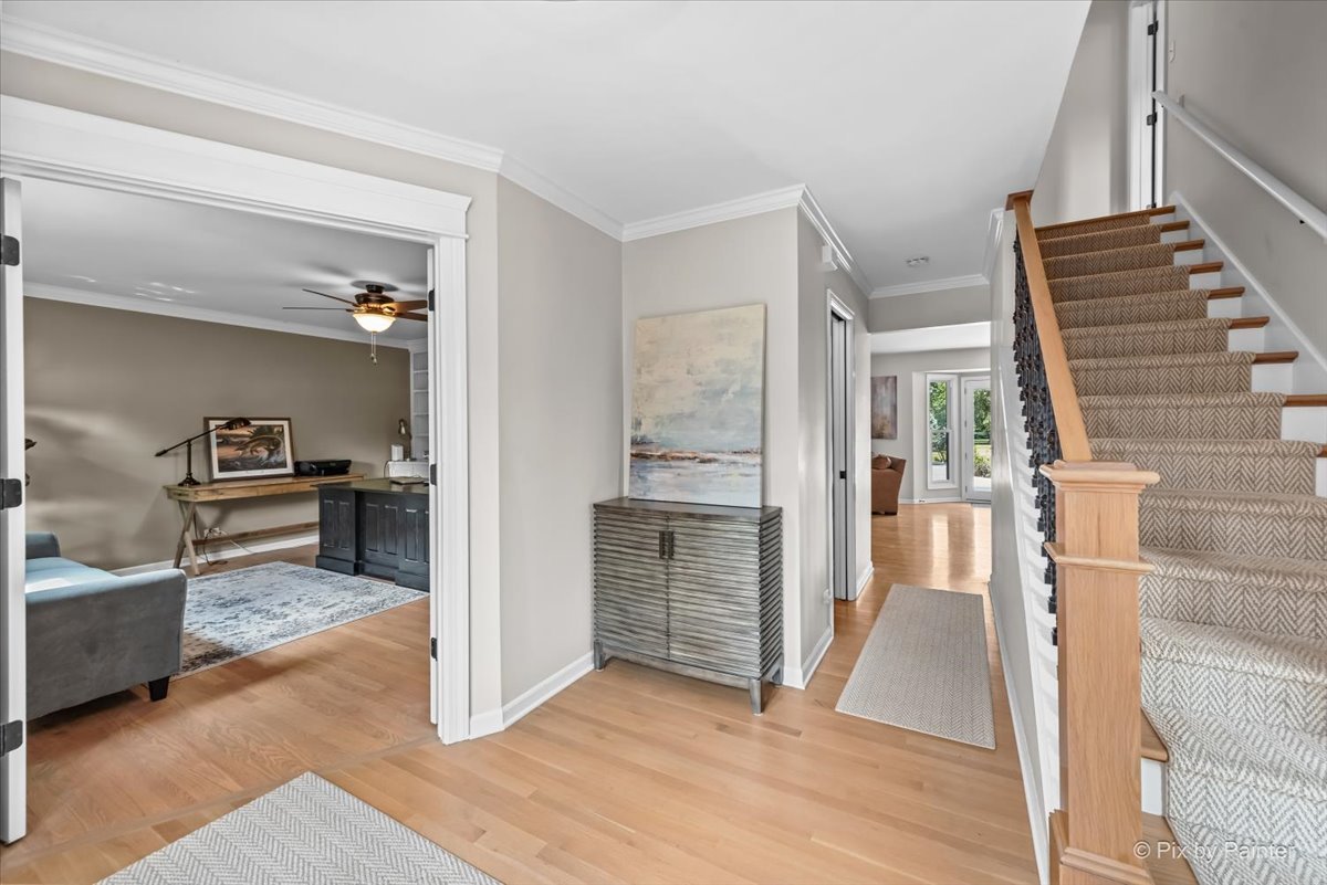 39W278 Baert Road St. Charles, IL 60175 - Photo 2 of 47 a view of a hallway view with wooden floor and staircase