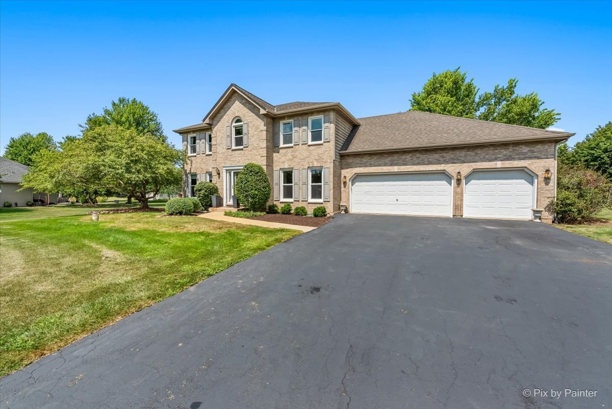39W278 Baert Road St. Charles, IL 60175 - Photo 30 of 47 a front view of a house with a yard and garage