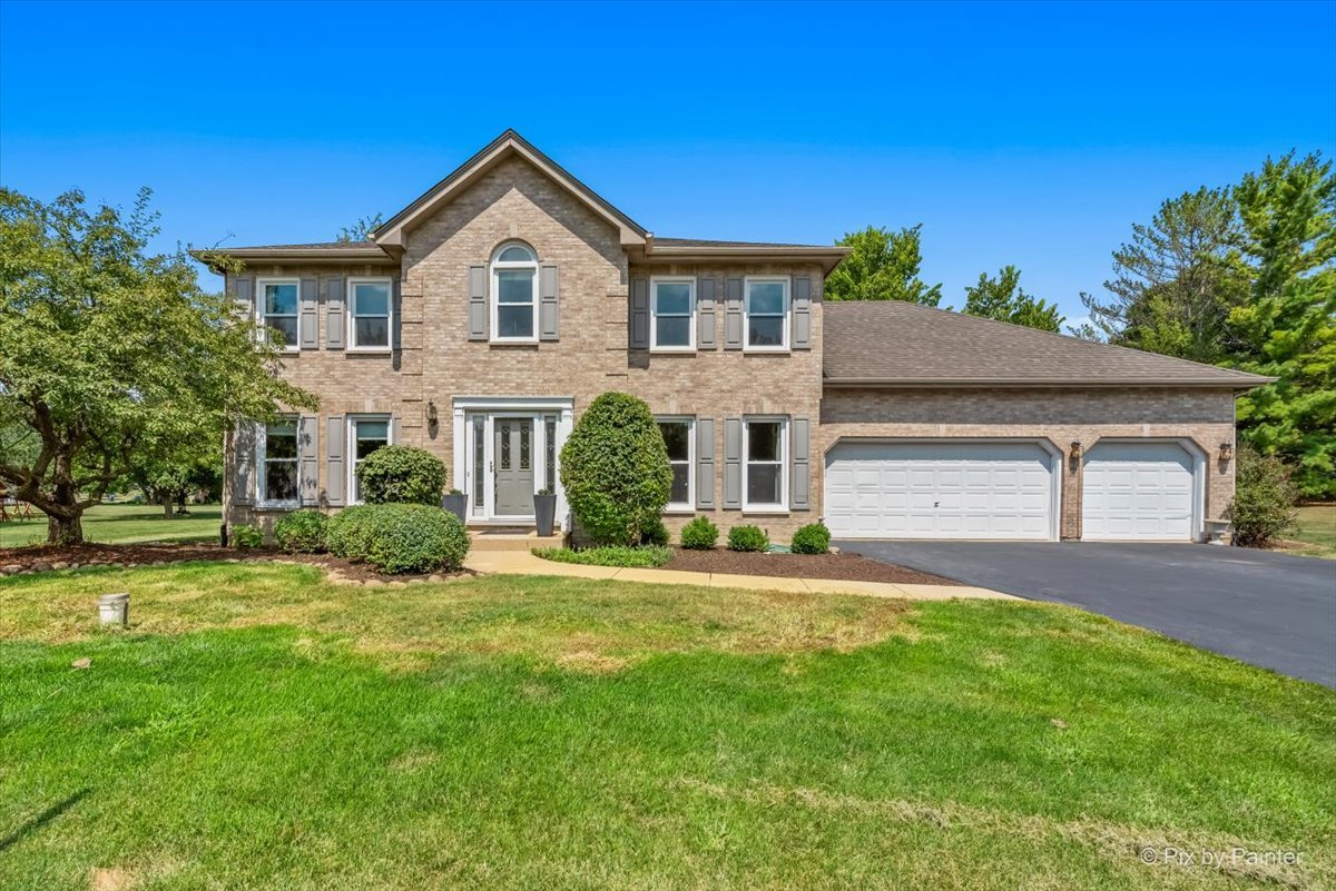 39W278 Baert Road St. Charles, IL 60175 - Photo 31 of 47 a front view of a house with a yard and garage