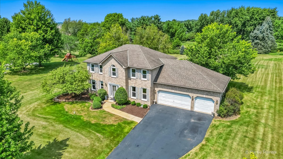 39W278 Baert Road St. Charles, IL 60175 - Photo 32 of 47 a aerial view of a house next to a big yard and large tree