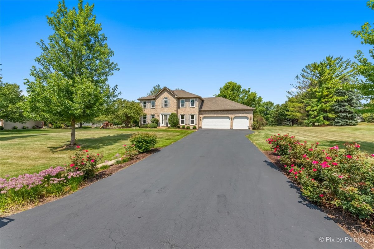 39W278 Baert Road St. Charles, IL 60175 - Photo 34 of 47 a view of a house with a big yard and potted plants