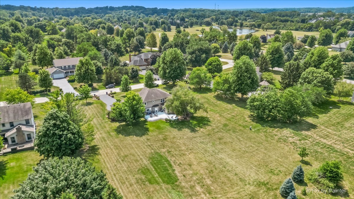 39W278 Baert Road St. Charles, IL 60175 - Photo 40 of 47 an aerial view of residential houses with outdoor space and trees