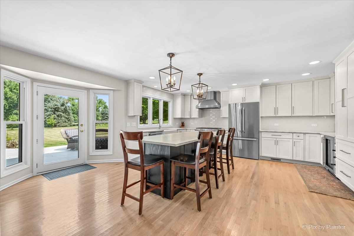 39W278 Baert Road St. Charles, IL 60175 - Photo 9 of 47 a view of a dining room with furniture window and wooden floor