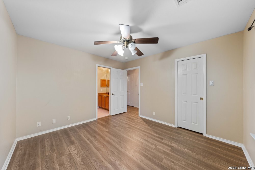 422 Arbor View Adkins, TX 78101 - Photo 21 of 29 a view of an empty room with a ceiling fan window and closet