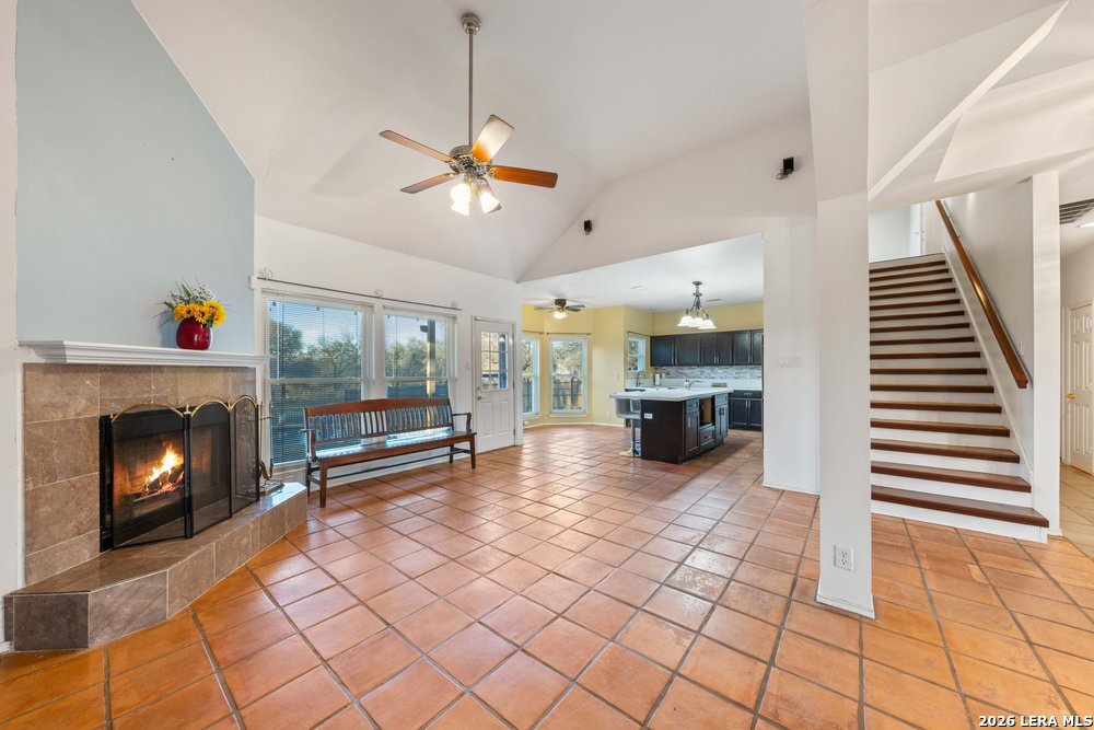 422 Arbor View Adkins, TX 78101 - Photo 7 of 29 a view of a livingroom with fireplace wooden floor and furniture