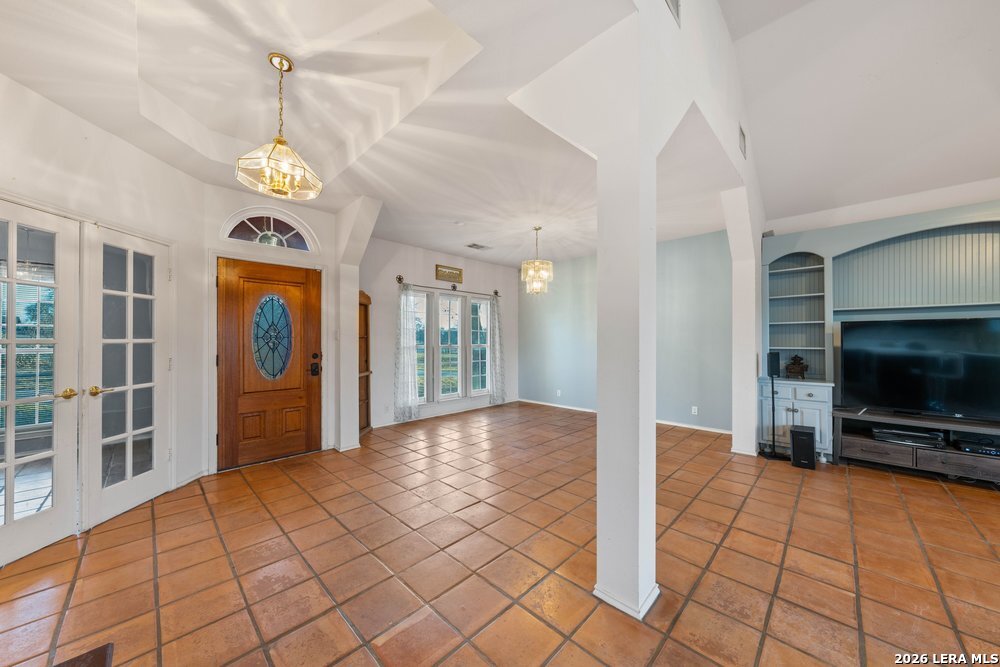 422 Arbor View Adkins, TX 78101 - Photo 10 of 29 a view of an entryway with a fireplace and a chandelier