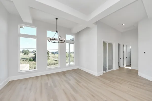 a view of a livingroom with wooden floor