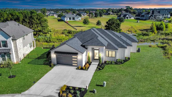 a aerial view of a house with a big yard
