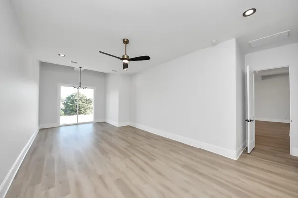 a view of an empty room with a fireplace