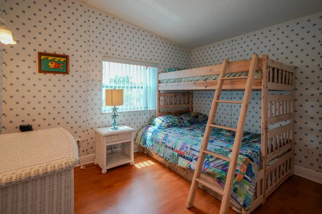 a bedroom with a bed and a table in it