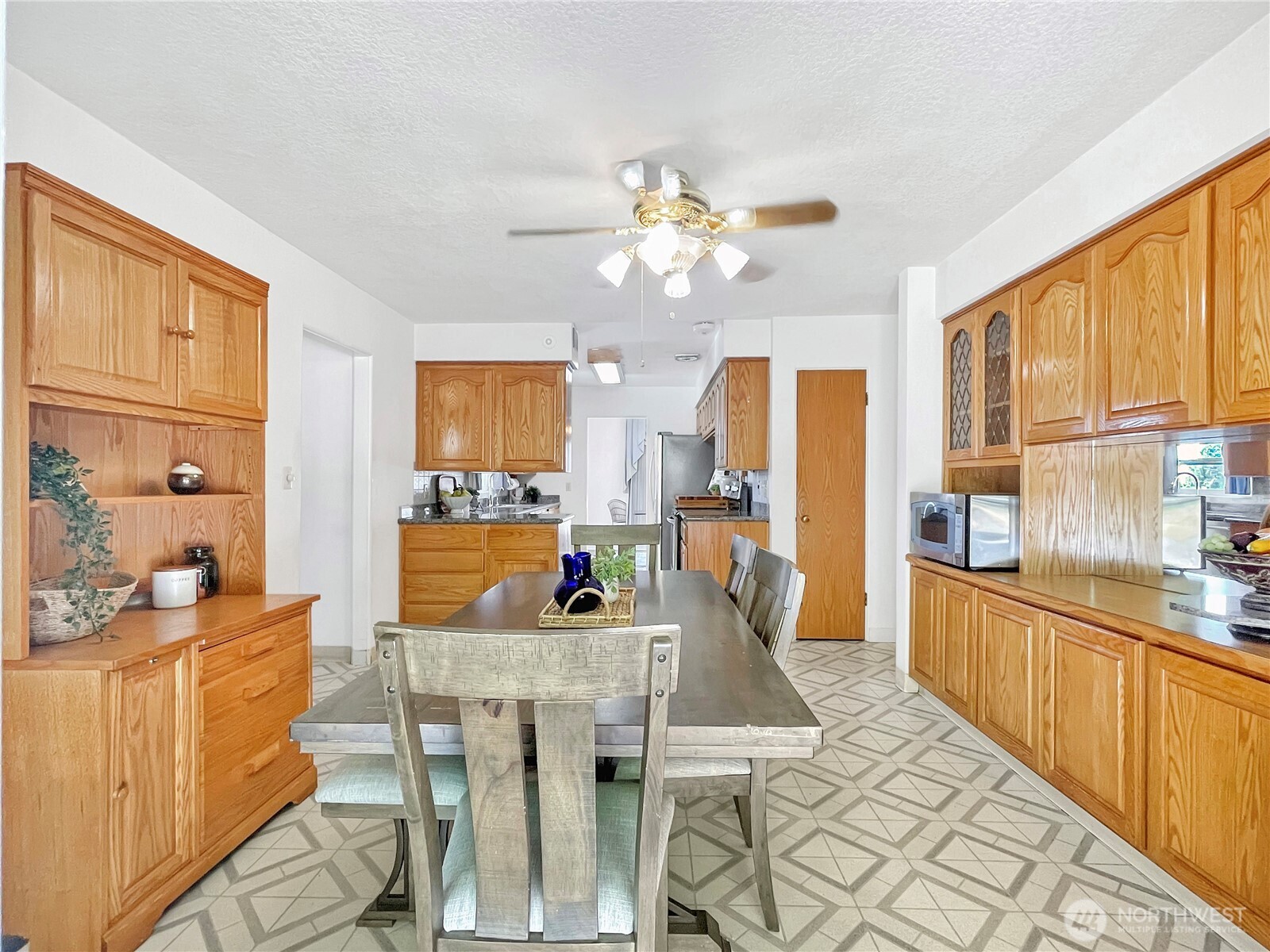 2116 Cascade Way Longview, WA 98632 - Photo 7 of 23 a kitchen with stainless steel appliances a dining table chairs and granite counter tops