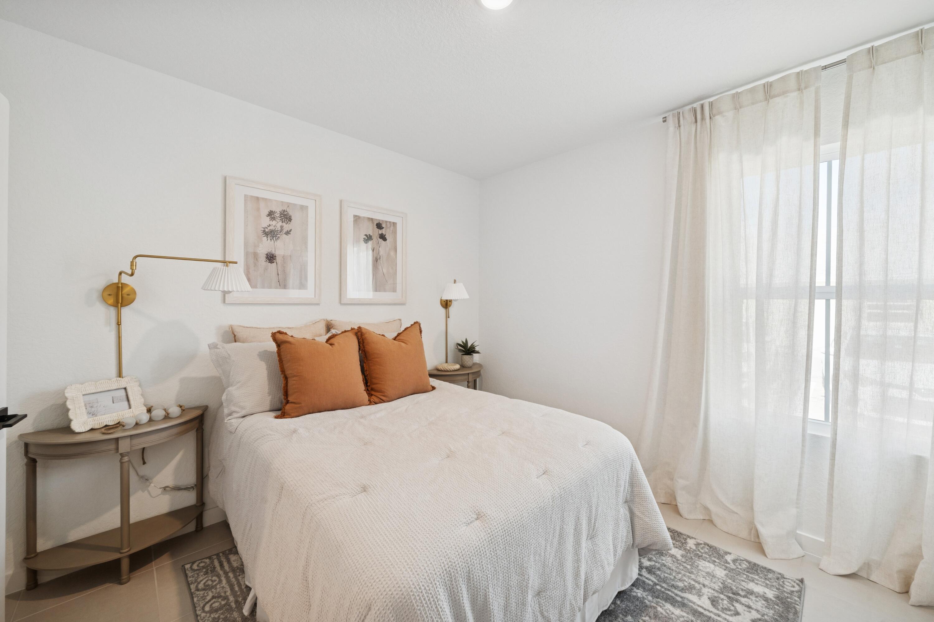 9728 Apollo Avenue, Unit 5 Fort Pierce, FL 34945 - Photo 10 of 39 a bedroom with a bed and a window