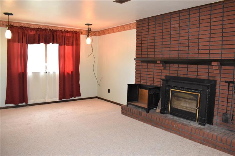 691 Bucktown Road Irwin, PA 15642 - Photo 12 of 23 Main Entry Family Room w/wood burning fire place.