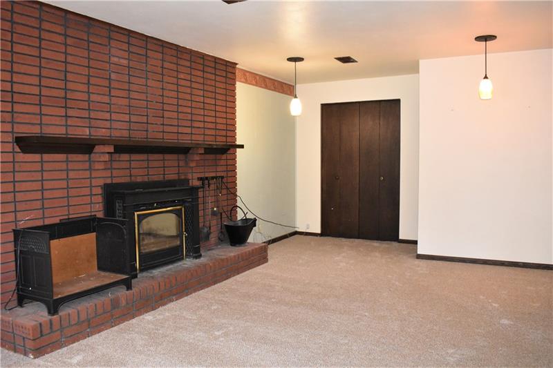 691 Bucktown Road Irwin, PA 15642 - Photo 13 of 23 Family Room has new carpeting and large closet for extra storage.