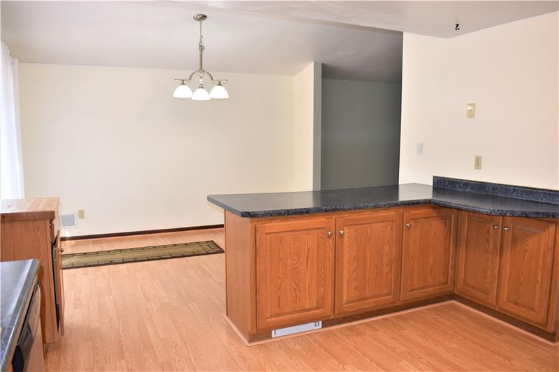 691 Bucktown Road Irwin, PA 15642 - Photo 7 of 23 Tons of cabinet space and separate cabinet with butcher block countertop.