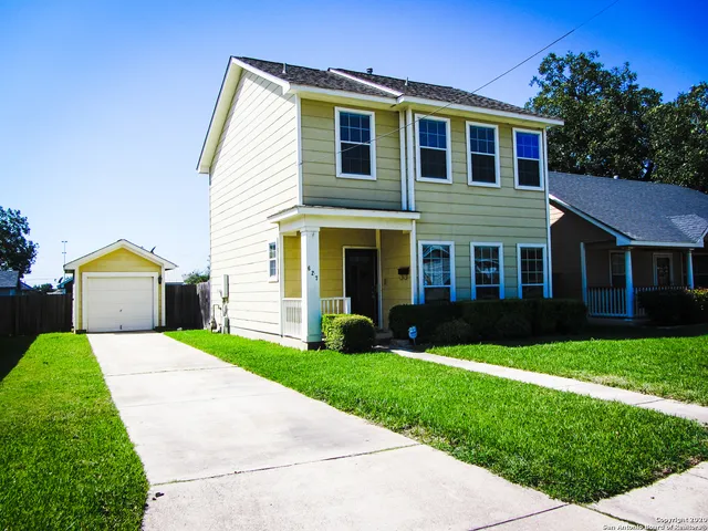a living room filled with furniture and a flat screen tv